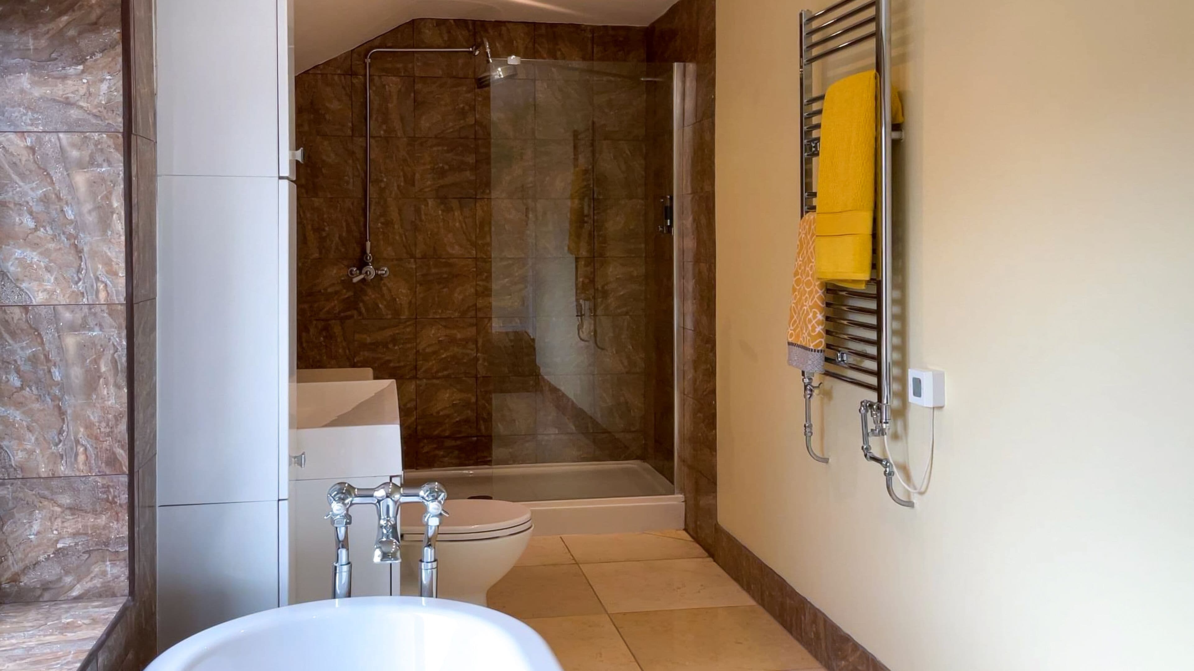 standard double room, shared bathroom, city view | bathroom | towels