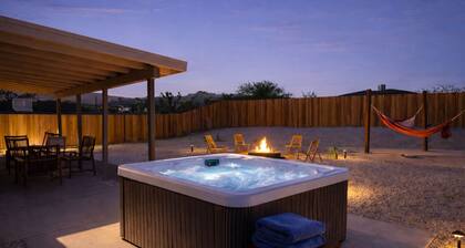 Private desert retreat on ½ acre with mountain views — stargaze from the fire pit or optional hot tub, relax in hammocks, and enjoy modern comforts just 15–20 minutes from Joshua Tree National Park.