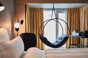 In-Tune Hanging Chair Room | Premium bedding, down comforters, blackout drapes, soundproofing