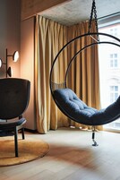 In-Tune Hanging Chair Room | Premium bedding, down comforters, blackout drapes, soundproofing
