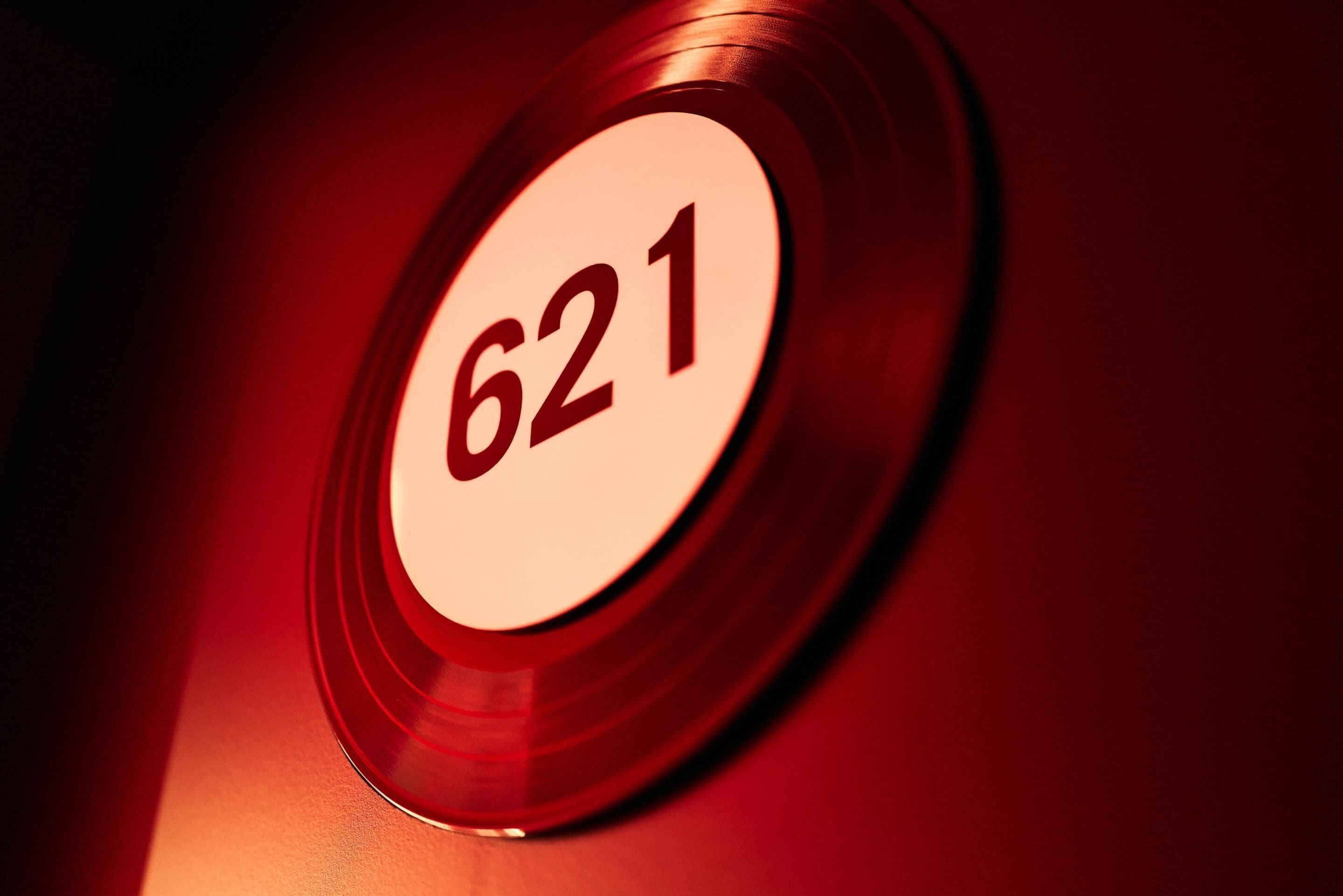 A close-up of a circular sign with the number 621.