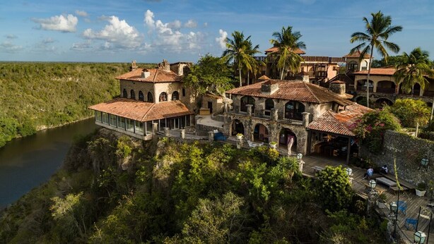 A coastal property with multiple buildings, a river, and lush greenery. - Lux Villa, Casa de Campo (La Romana)