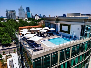 Outdoor pool, cabanas (surcharge), pool umbrellas at The Tess, Autograph Collection