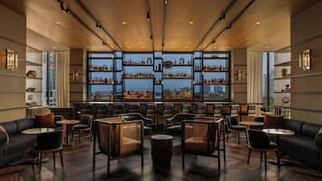 3 bars/lounges, rooftop bar, lobby lounge