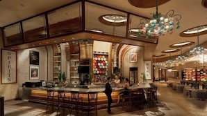 A bar area with a counter, seating, and a decorative ceiling. - InterContinental Grand Ho Tram (Ho Chi Minh City)