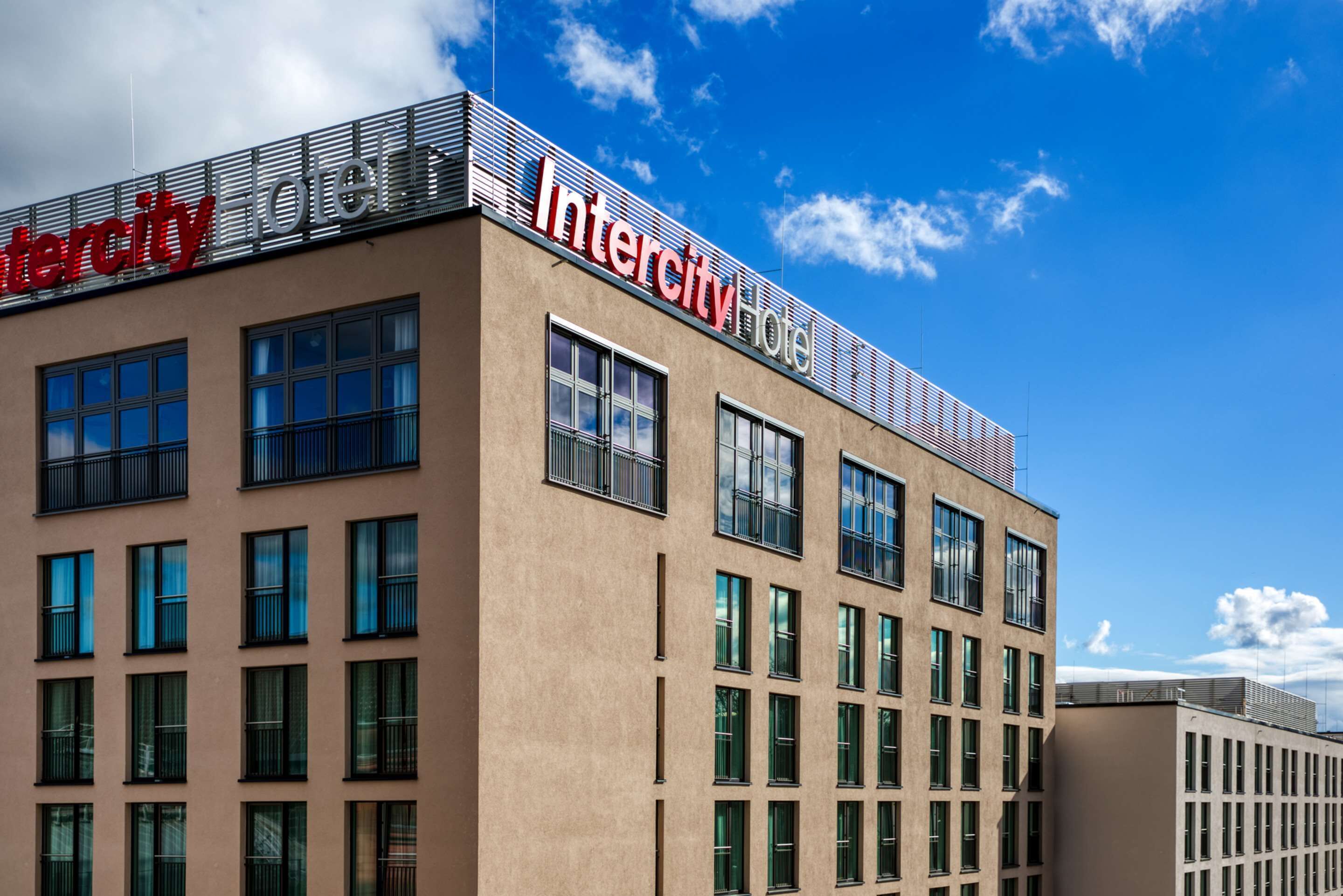 A modern building with the name "Intercity Hotel" prominently displayed on the facade.