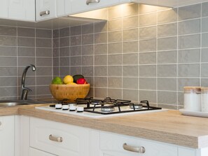 Fridge, dishwasher, coffee/tea maker, cookware/dishes/utensils