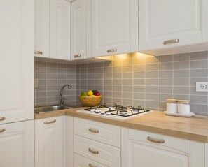 Fridge, dishwasher, coffee/tea maker, cookware/dishes/utensils