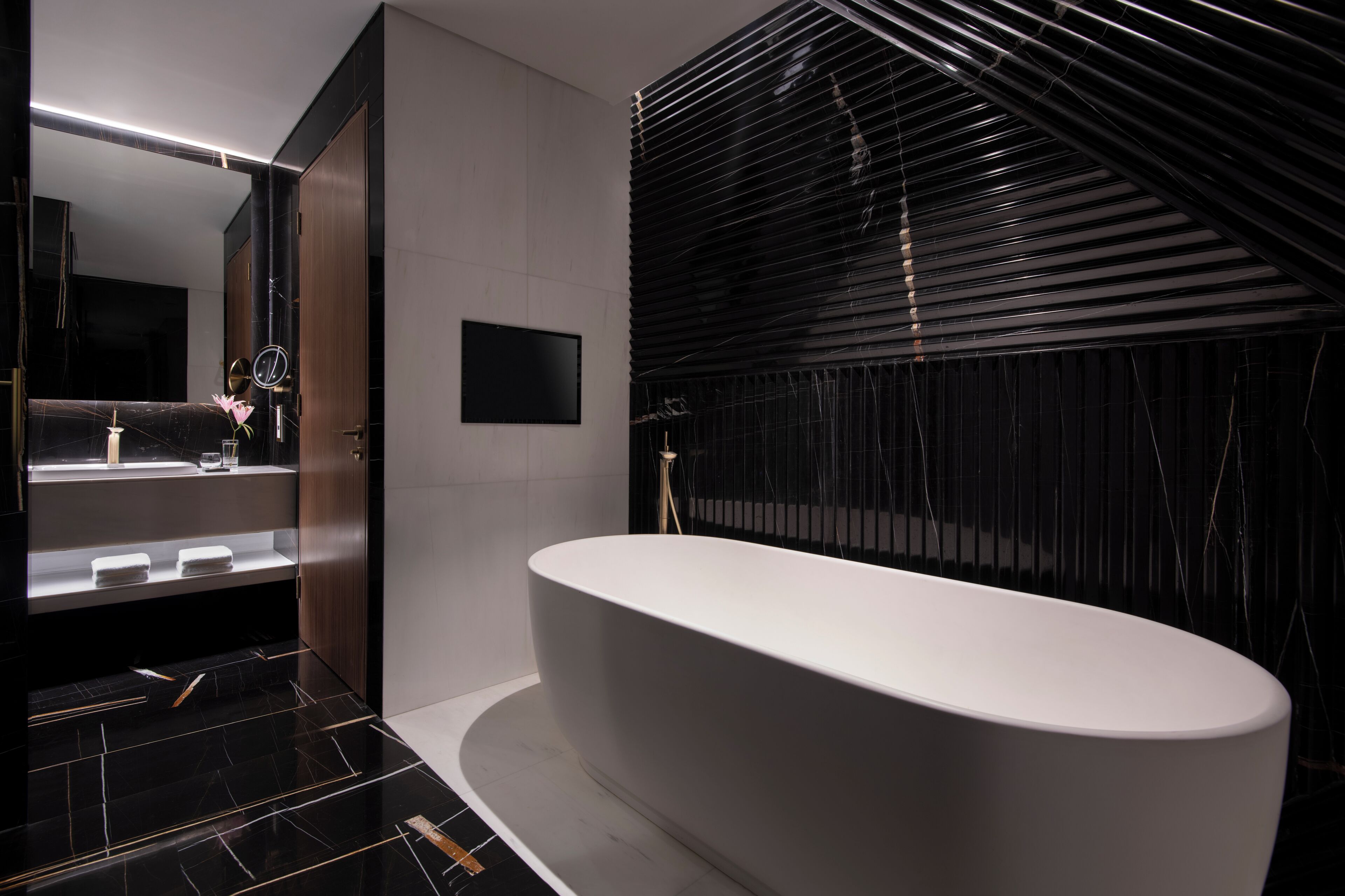 executive suite | bathroom | rainfall showerhead, designer toiletries, hair dryer, slippers