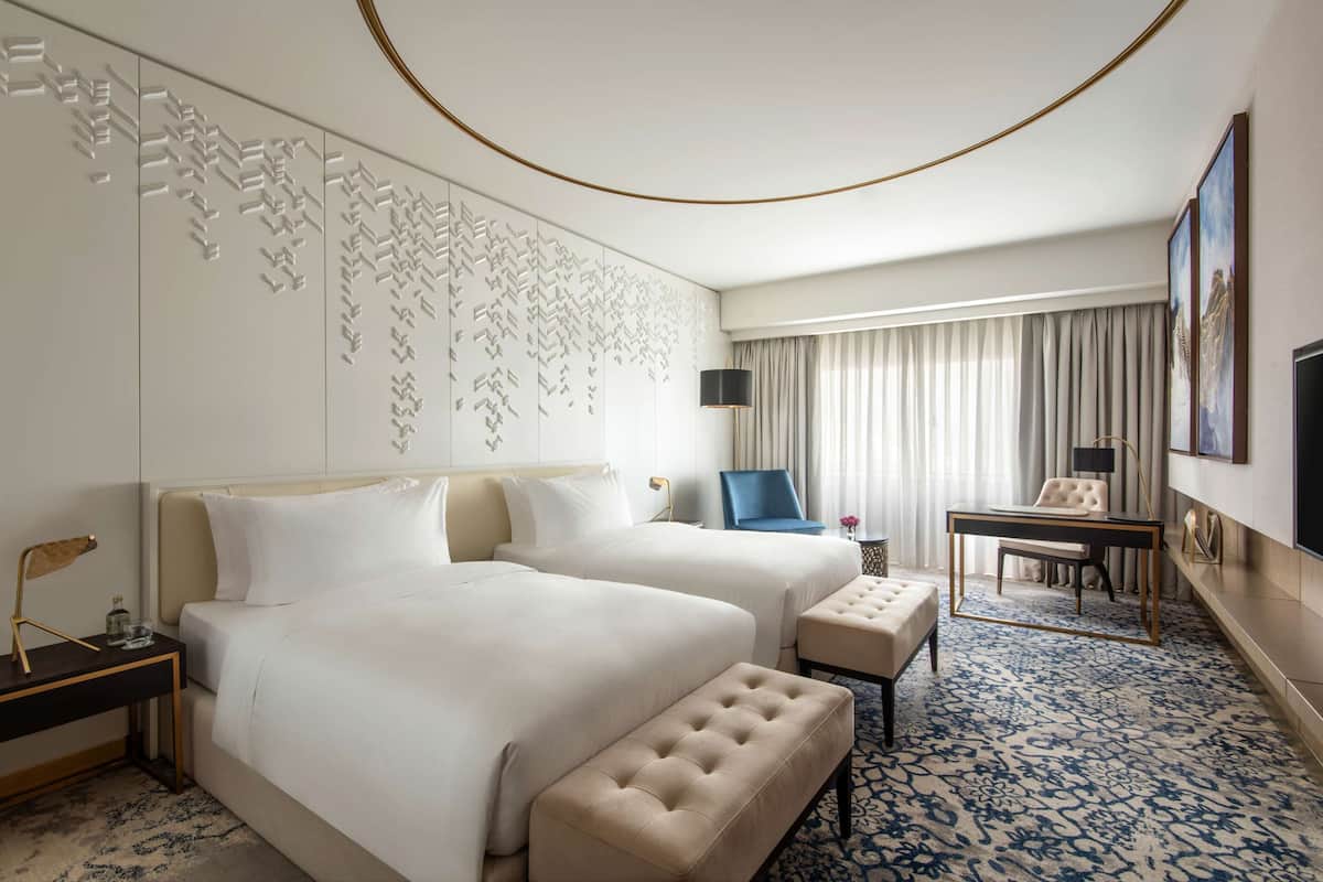 Luxe beddengoed, donsdekens, pillowtop-bedden, een minibar