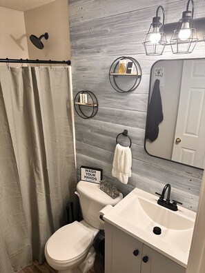 Combined shower/tub, hair dryer, towels, soap