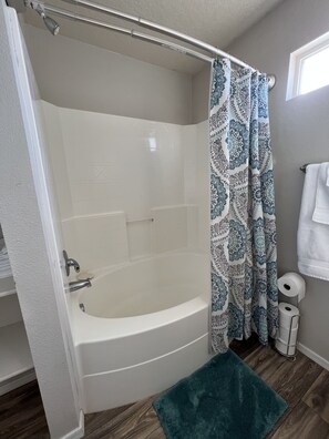 Combined shower/tub, hair dryer, towels, soap - Cozy multi family home with lots of space to keep everyone entertained! (Boise)