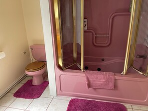 Bathtub, hair dryer, towels, soap