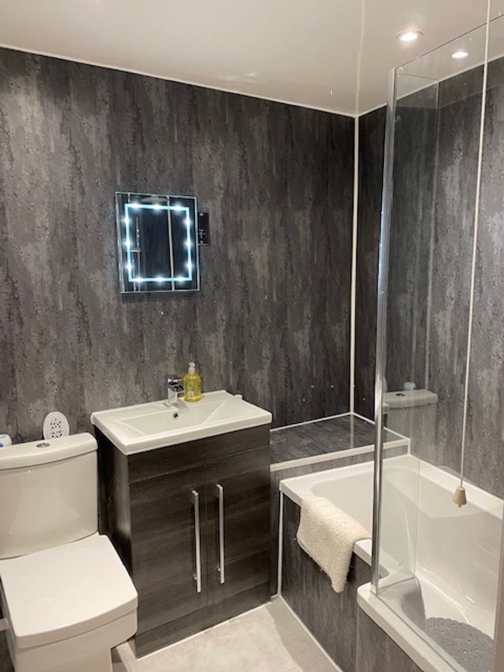 Combined shower/bathtub, hair dryer, towels, soap