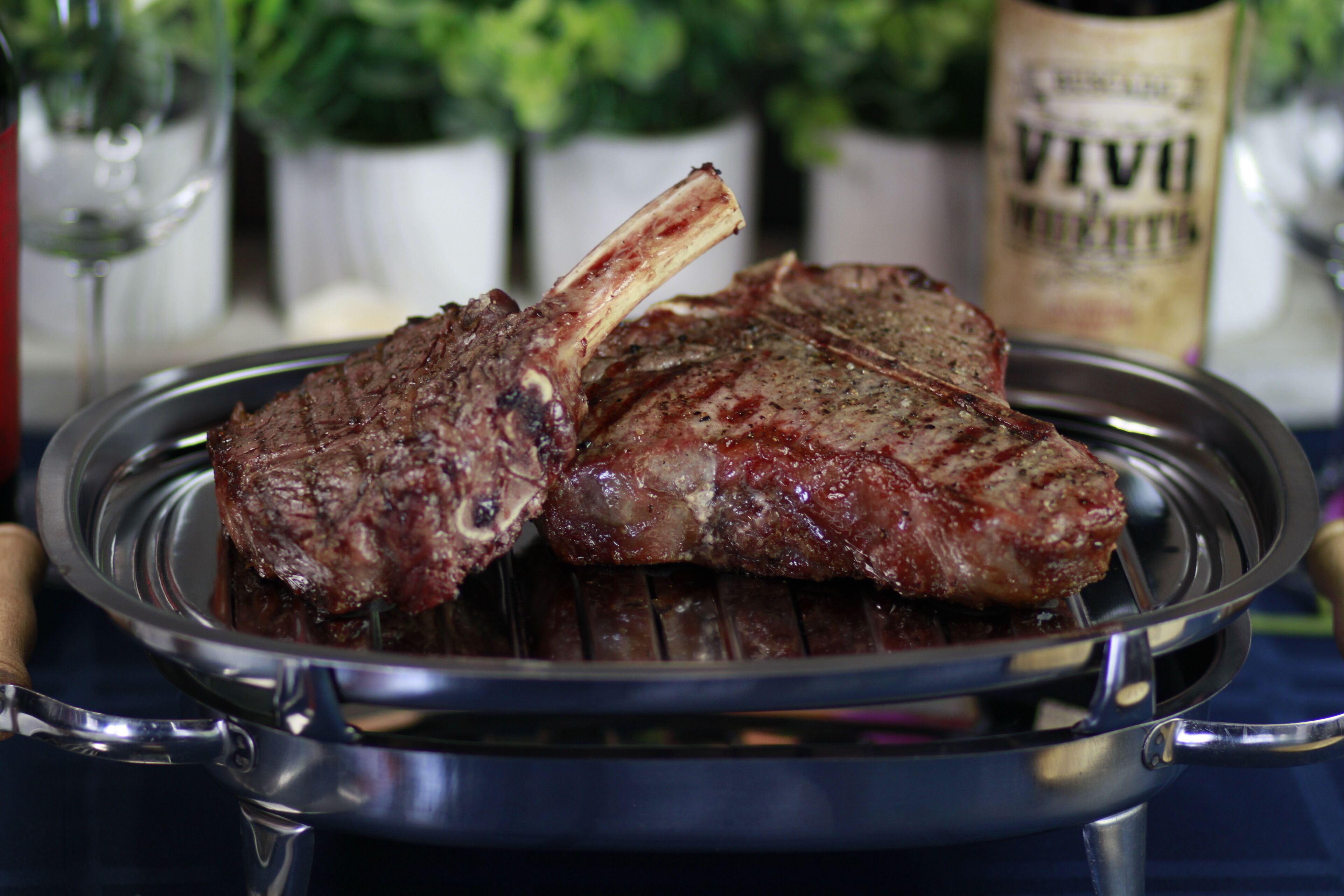 A grill with two steaks on a plate.