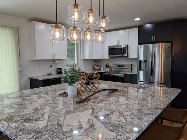 Microwave, dishwasher, coffee/tea maker, cookware/dishes/utensils