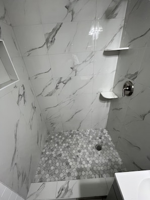 Combined shower/tub, hair dryer, towels, soap