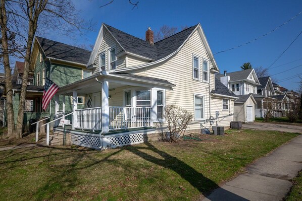 Stunning two-story home with a charming front porch and inviting entrance.