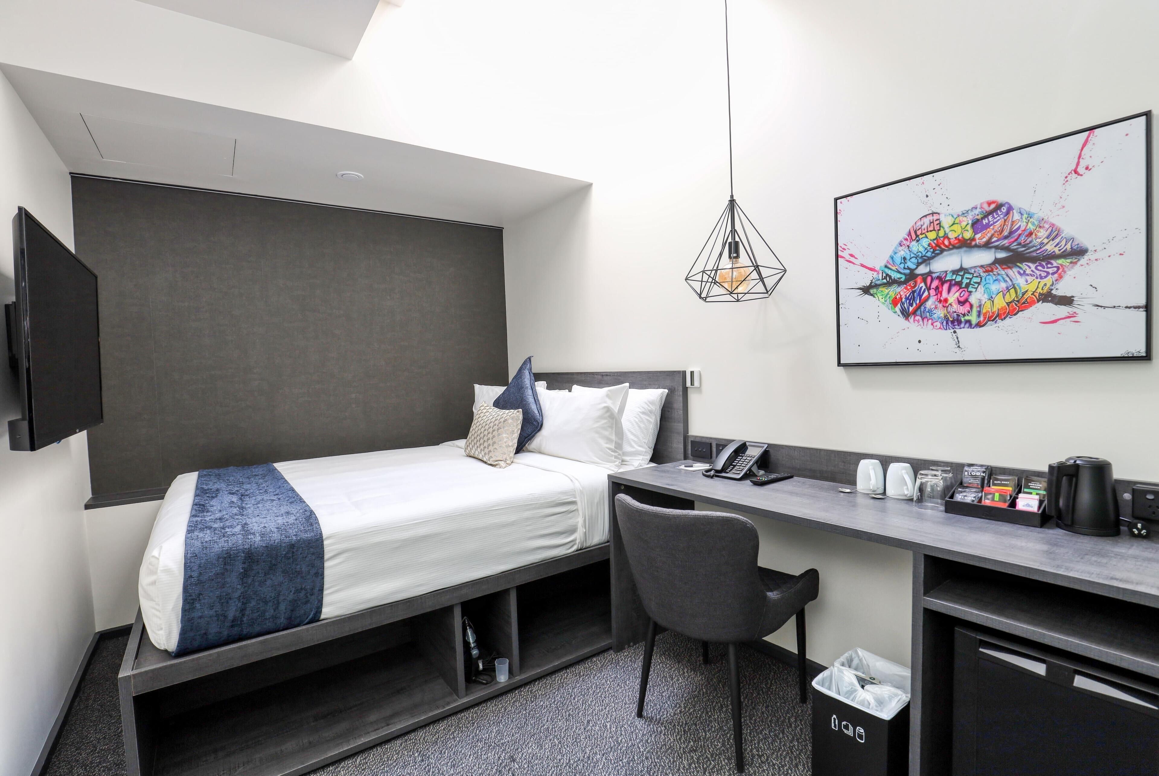 Desk, laptop workspace, free WiFi, bed sheets