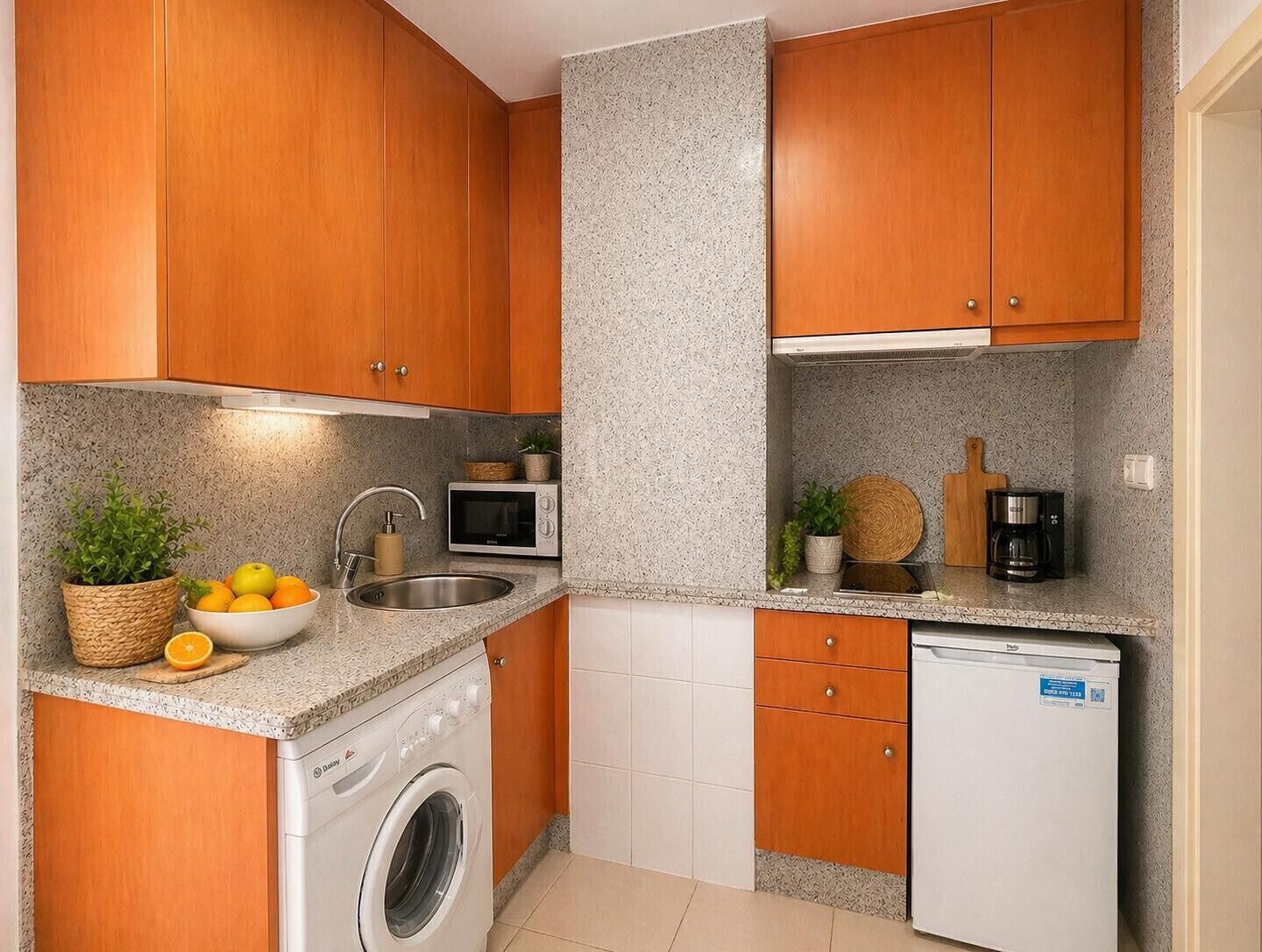 Fridge, microwave, coffee/tea maker, cookware/dishes/utensils