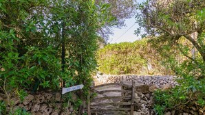 A stone bridge with a sign reading 'BEACH' leading to a beach area. - Vacation Villa "Villa Diani" with Pool, Wi-Fi, Garden & Terrace (Binibequer)