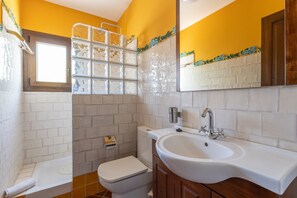 Bathtub, hair dryer, towels