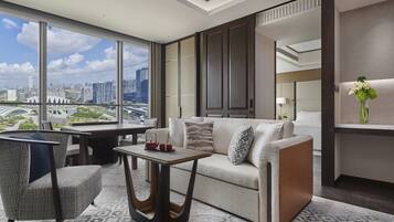Deluxe River View Suite King | Living area | 55-inch Smart TV with cable channels, TV