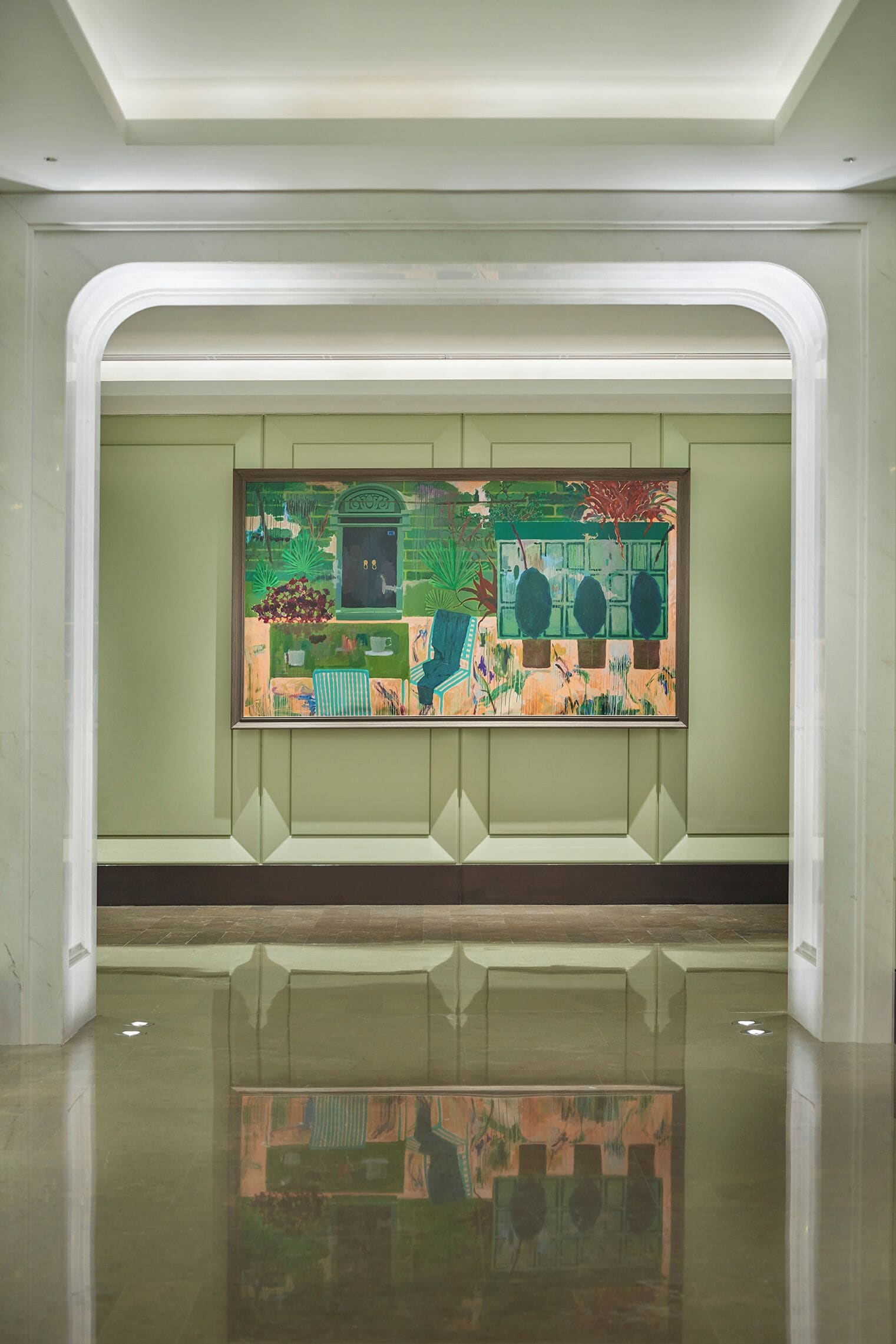 A modern interior with a reflective floor, a large abstract painting on the wall, and a clean, minimalist design.