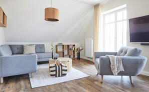 Superior Suite with Balcony, incl. 150 Euro Cleaning Fee | Living area | Flat-screen TV