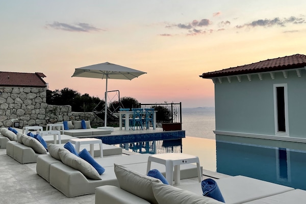 Seasonal outdoor pool, open 9:00 AM to 8:00 PM, pool umbrellas