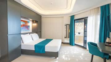 Family Room, Jetted Tub, Sea View | Minibar, in-room safe, desk, laptop workspace