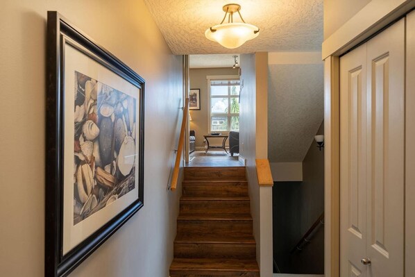 A staircase with wooden steps leading to a landing.
