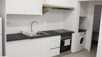 Economy Loft | Private kitchen | Full-size fridge, microwave, oven, stovetop