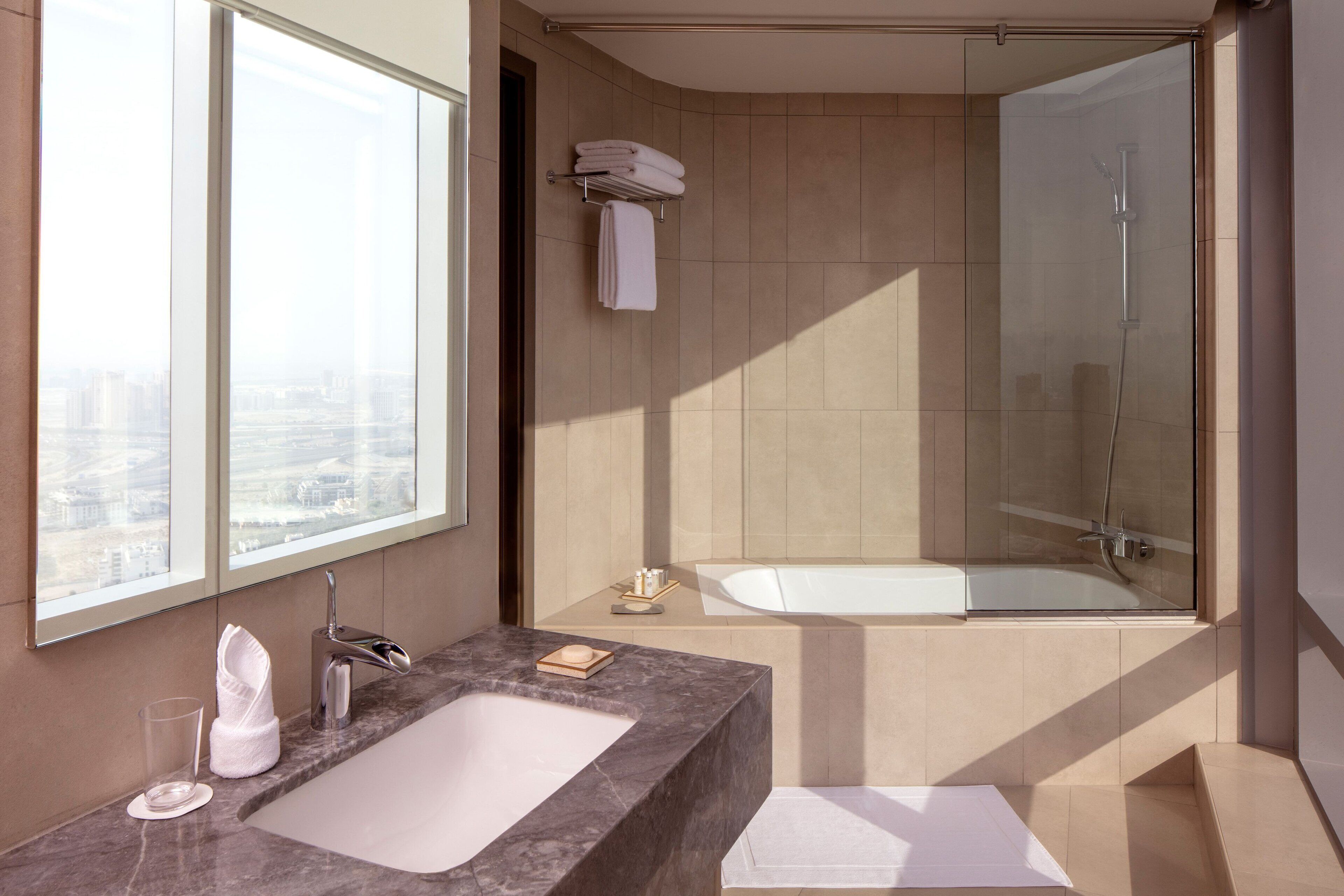 combined shower/bathtub, eco-friendly toiletries, hair dryer, bathrobes