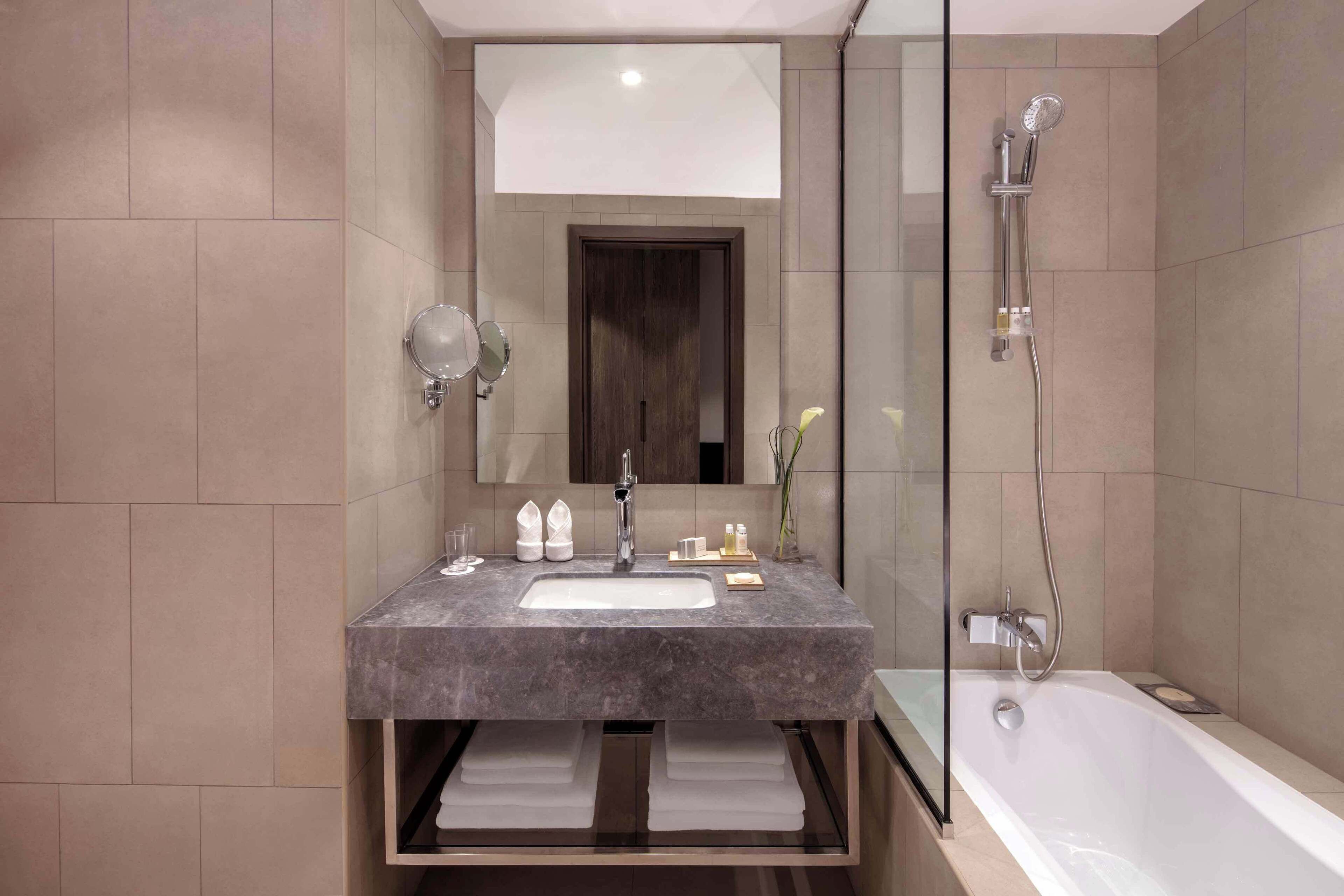 combined shower/bathtub, eco-friendly toiletries, hair dryer, bathrobes