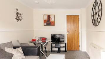 Apartment | Living area | 30-inch TV with digital channels