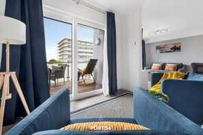 Relax in this stylish room with a balcony, comfortable seating area, and beautiful views.