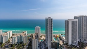A high-rise hotel with a view of the ocean, multiple swimming pools, and a parking area. - Hyde Beach House Luxury Condo-resort 2 Bedroom Condo by RedAwning (Hollywood)