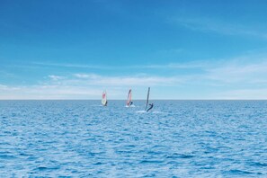 Guests can enjoy windsurfing in a tranquil ocean setting.