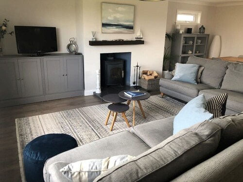 Family Home with stunning beach and mountain views.