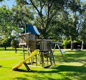 Children's area - Ranch-Style Oasis: Private CozyXscape with Pool & Fire Pits sleeps 10 (Montgomery)