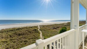 A beach view from a balcony with a clear sky and sun shining. - Charming Ocean-view Condo at Ocean Pier 3 (North Myrtle Beach)