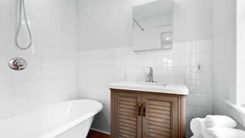 Bathtub, hair dryer, towels, soap