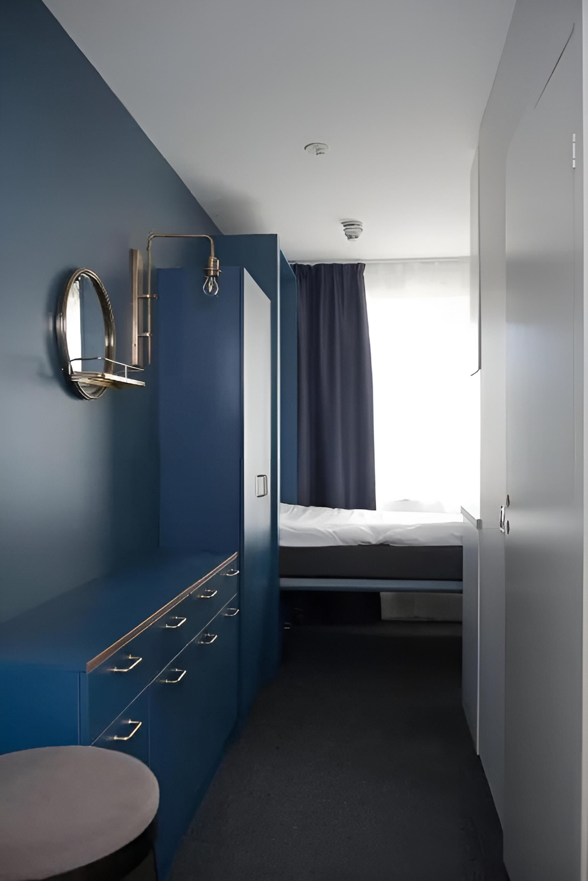 economy studio | premium bedding, laptop workspace, blackout curtains, soundproofing