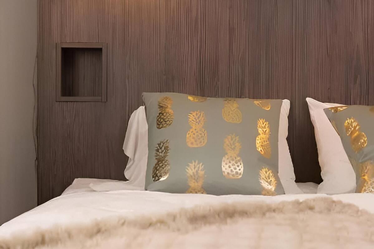 premium bedding, laptop workspace, blackout curtains, soundproofing