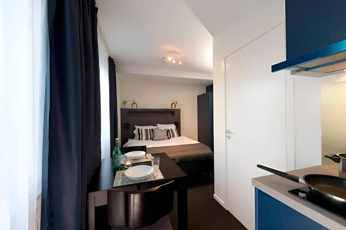 classic studio | premium bedding, laptop workspace, blackout curtains, soundproofing