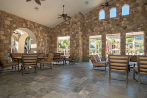 Relax in this inviting space with comfortable seating and natural light pouring in through the stone walls and windows.