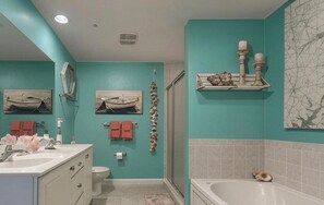 Combined shower/tub, hair dryer, soap, shampoo