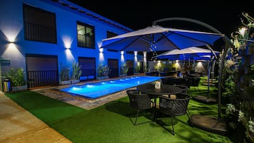 Outdoor pool, open 9:00 AM to 9:00 PM, pool umbrellas, pool loungers