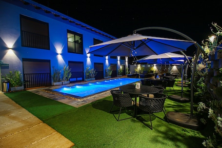Outdoor pool, open 9:00 AM to 9:00 PM, pool umbrellas, sun loungers